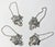 Set of four silver plate liquor tags in a grape and leaf motif. Engraved with GIN, VODKA, SCOTCH and BOURBON. Extends to...