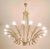 Italian chandelier in brass and lacquered metal with 16 lights. Made in Italy in the 1950s New electrical system with...