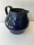 Handmade, studio pottery pitcher, glazed in and out. Cobalt blue exterior with a green, almost verdi gris interior. Signed...