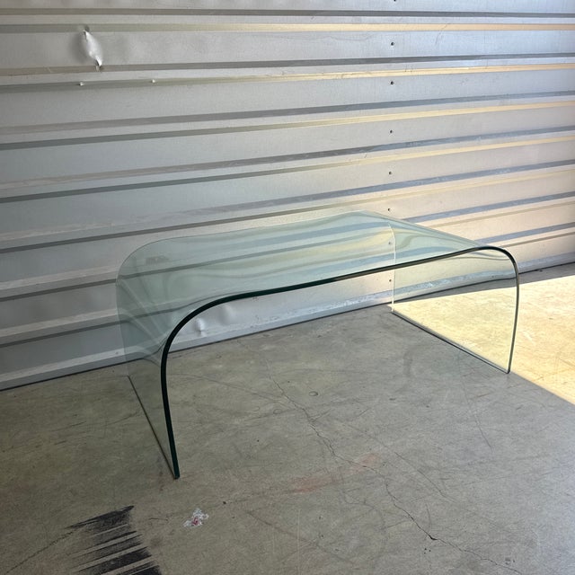Gorgeous vintage glass table in the style of Angelo Cortesi. One solid piece of glass. Very heavy. Glass is about 1/2”...