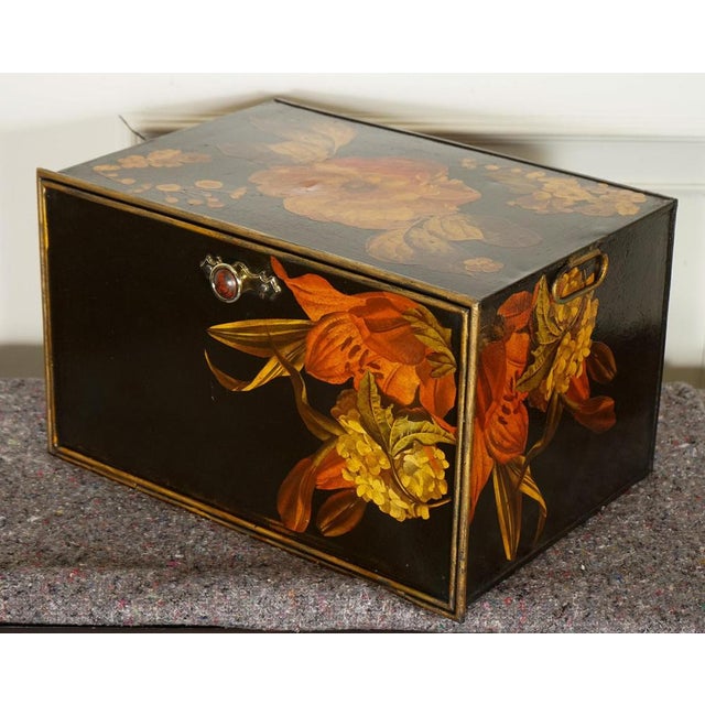 The vintage Shaw & Sons metal storage box is a charming decorative piece that features an intricately hand-painted floral...