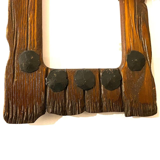 DETAILS An antique, hand carved, hickory wood frame designed to look like a rustic fence with large iron rosehead nails....