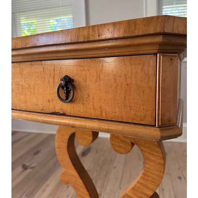 The piece is sturdy, elegant, and adds a quiet sophistication to an entry, reading corner, or beside a slipper chair....