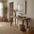 A striking antique console table crafted from a vintage butcher block, rich with character and utilitarian charm....