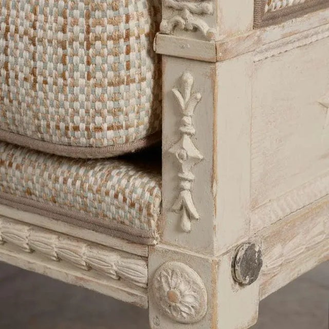 Elegant period Gustavian sofa with wonderful original carved details. Lion heads on top of armrest and female head on...