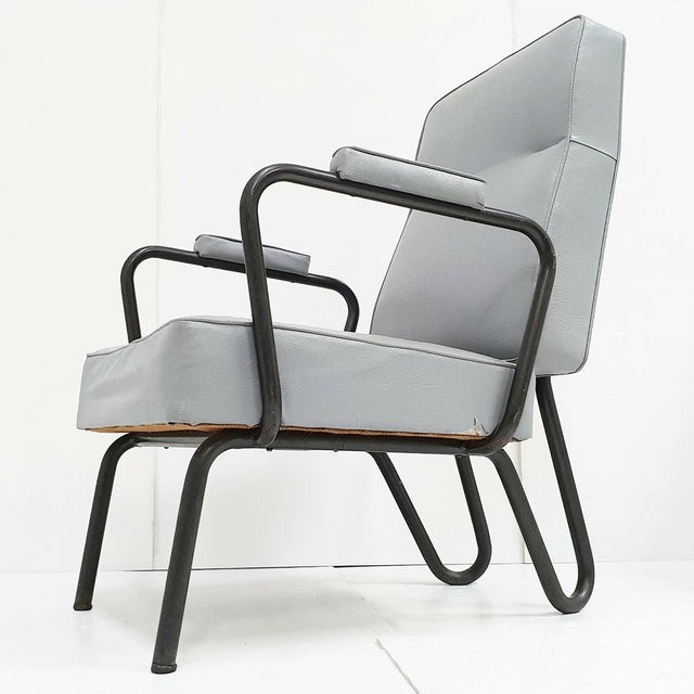 Good overall condition. Usual signs of wear, particularly on the steel tube, and a small tear on the side. Backrest in...