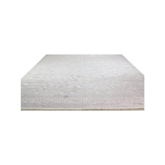 Handwoven 12x15 Tabriz Area Rug featuring an intricately rendered all-over design on a cream field surrounded by a...