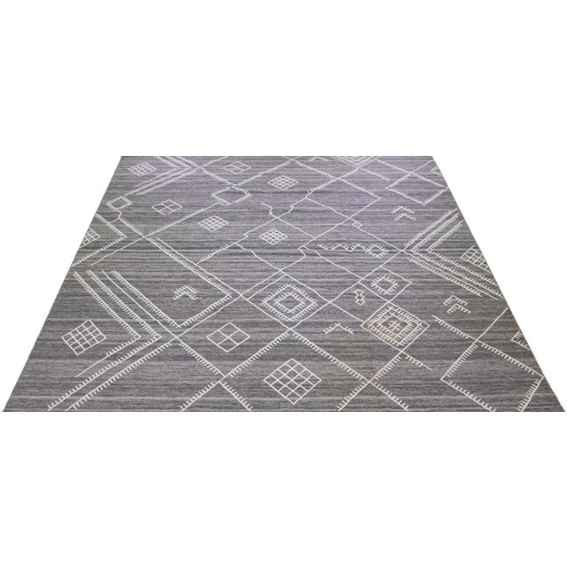 Beautiful kilim handmade wool rug with a gray field. This custom modern flatweave rug of our Nantucket collection has...