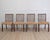 A handsome set of eight Danish dining chairs by A.J. Iversen, crafted in rich mahogany with elegant proportions and...