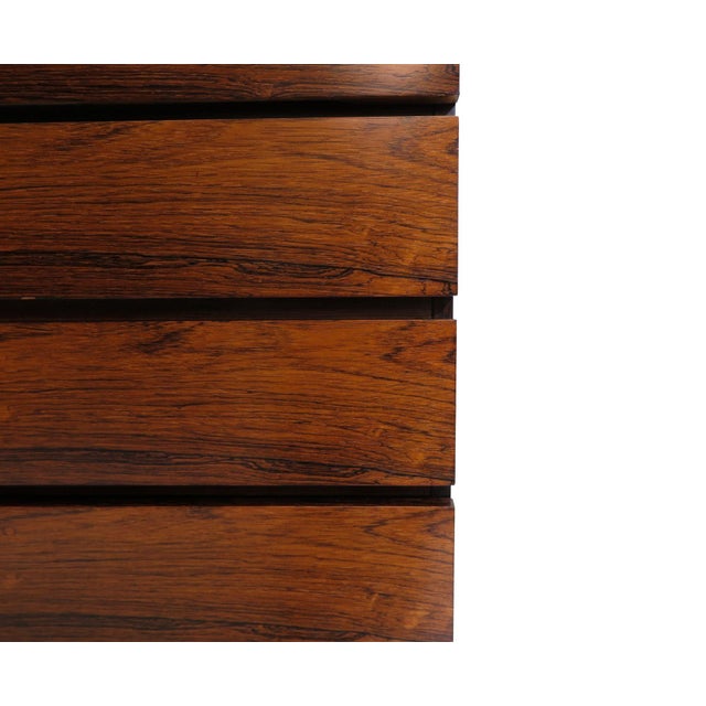 Brazilian rosewood five-drawer dresser designed by Kai Kristiansen. Features a minimalist design with beautifully grained...
