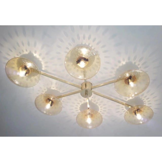 Italian asymmetrical flush mount with six amber Murano glass shades carefully hand blown with bubbles inside the glass...