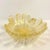 Midcentury, Murano-attributed, Italian, hand-blown, art glass clamshell dish or ashtray is embellished with gold flecks...