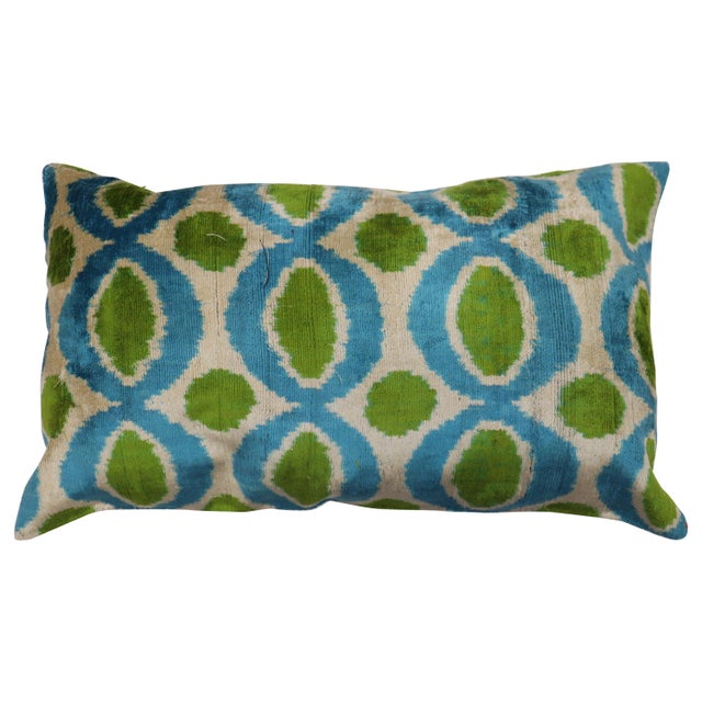 Pillow made from a silk Ikat pillow. zipper closure and poly-fill insert provided. Measures: 14'' x 24''.