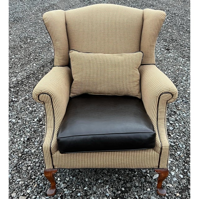 Handsome Queen Anne wingback with houndstooth upholstery. Classic Queen Anne legs , wingback construction , contrast...