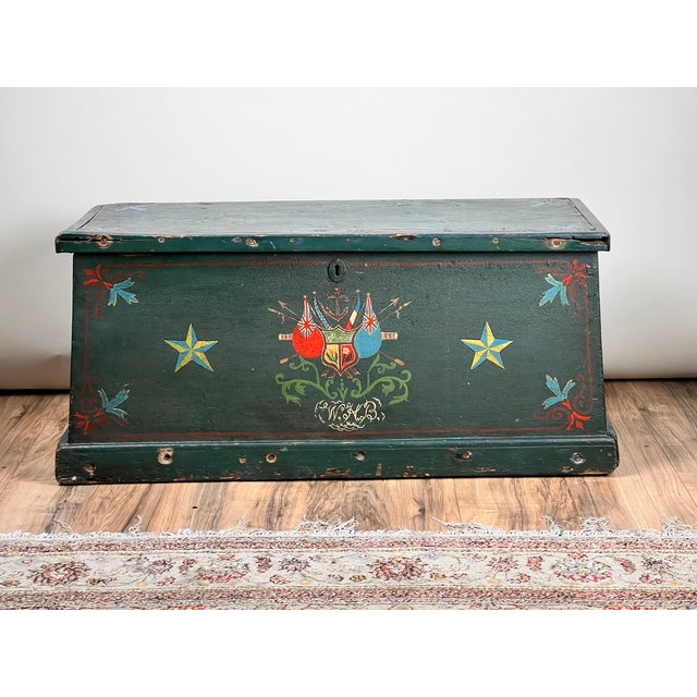 A striking late 19th century English sea chest, richly decorated with bold painted motifs that speak directly to its...