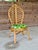 A beautifully sculptural vintage rattan side chair featuring an eye-catching leaf-form back, a signature detail that gives...