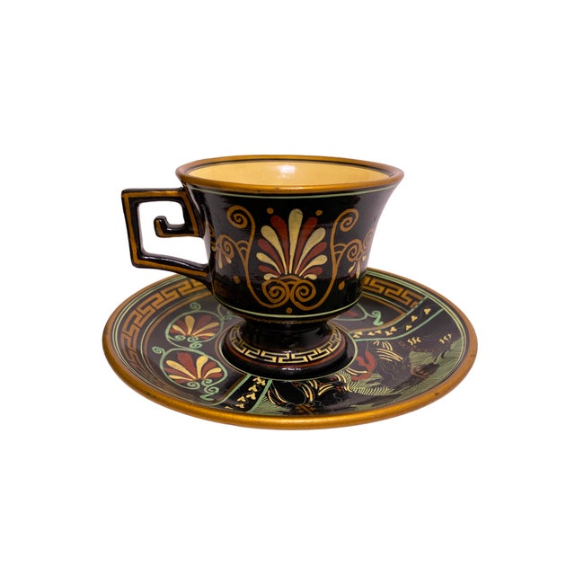 Greek Pottery Teacup and matching Saucer set depicting Greek Mythology. Hand-made and hand-painted in Greece. Is signed on...