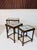Elegant three-piece nesting table set of Scandinavian origin, made in Sweden around 1930. The decorative tabletops feature...