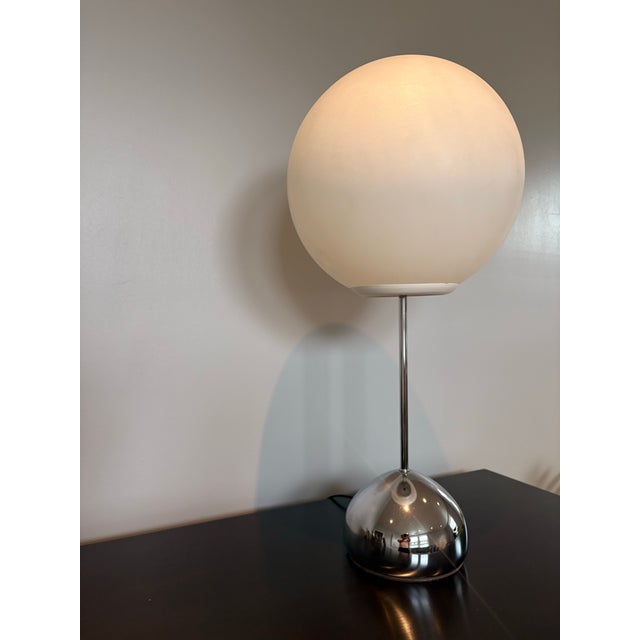 Light becomes sculpture. Robert Sonneman's iconic "Lollipop" lamp is a masterclass in restraint—pairing polished chrome...