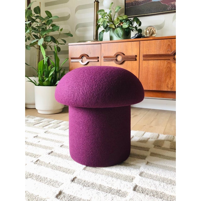 A handmade mushroom shaped ottoman, upholstered in "Plum" dark purple wool fabric. Perfect for using as a footstool or...