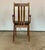 A pair of high-backed dining table chairs with armrests. Frame made of solid and dark-stained beech wood. Seats...