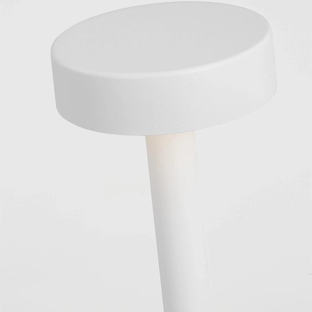 The Moneta Rechargeable Table Lamp by Sean Lavin exudes elegance and simplicity. Designed to blend into any modern setting...