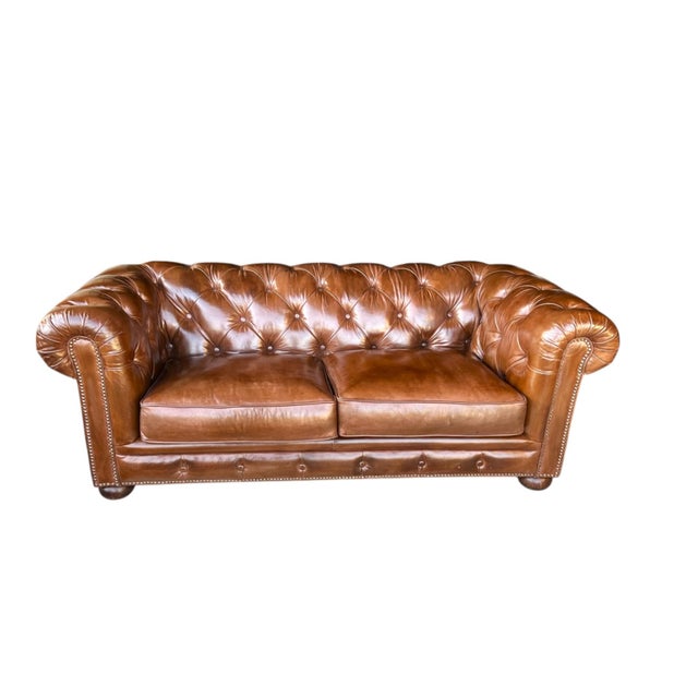 This stunning vintage Chesterfield sofa has been completely restored and professionally newly dyed in a light brown color,...