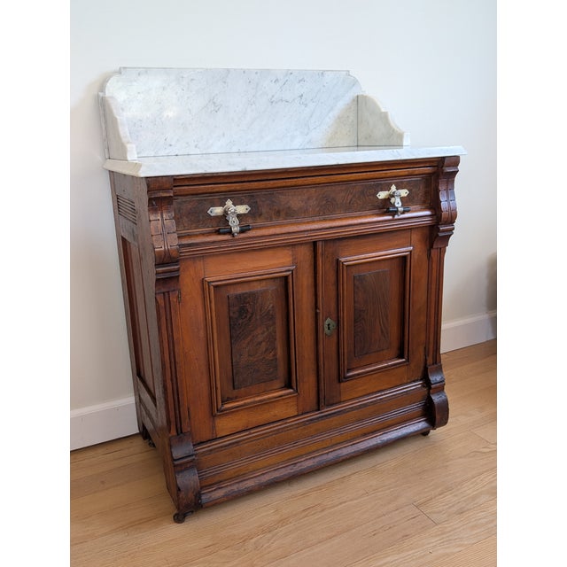 This Eastlake marbletop washstand was made in the late 1800's and features many details common to Victorian Renaissance...