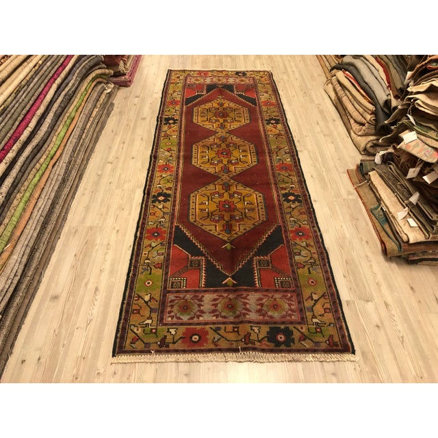 This is a vintage Turkish Oushak rug from the 1960s. The piece was hand-knotted.