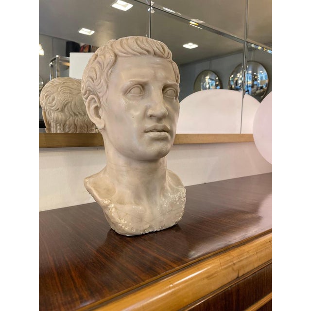 Early 19th-century marble bust of a Roman emperor, in the style of Augustus portraits. Carved in white marble, it depicts...