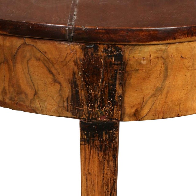 An elegant 19th-century oval mahogany table featuring beautifully figured grain and a warm, rich patina. The simple oval...