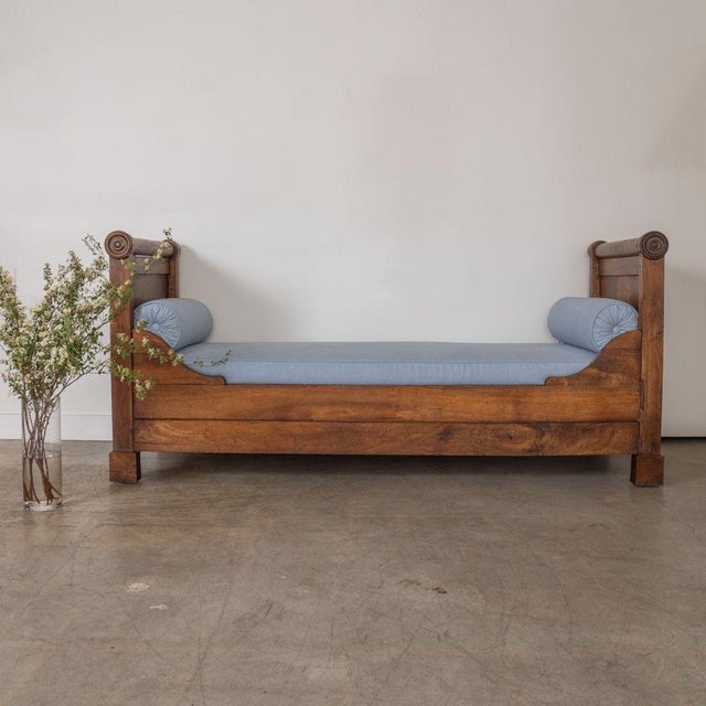 Incredible empire style carved wood daybed from France, late 19th century. Long oak wood frame with high sides showing...