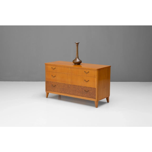 Mid-Century Swedish three drawer chest of drawers in Elm and burr Elm. Original handles. Re-finished. Sweden circa 1950.