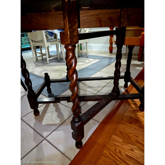 Antique Oak Gateleg Drop-Leaf Table with Barley Twist Leg This sturdy oak gateleg table has a dark wood finish and...