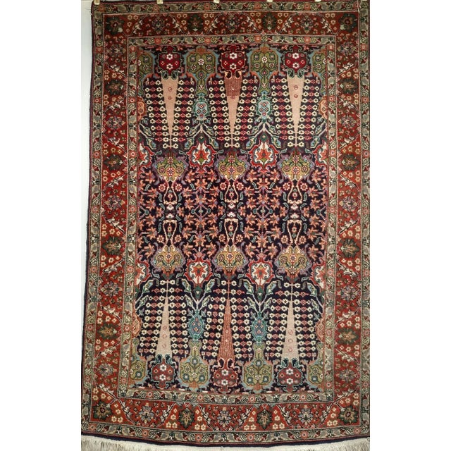 This exceptional antique Tabriz rug from the early 20th century features an exquisite allover design that reflects the...