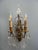 This pair of wall lamps is an excellent example of elegant historical lighting. Made of bronze and decorated with crystal...