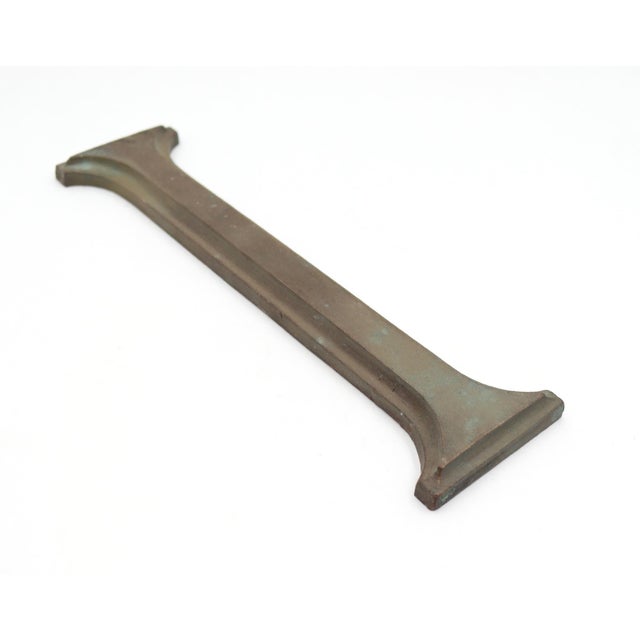 Vintage roman serif style letter I sign made of bronze with a dark bronze and verdigris finish. The piece is flat on the...