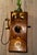 Imported antique Argentine wall-mounted telephone featuring a richly grained oak case, brass bells, rotary dial, and side-...