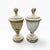 A pair of matching carved wood finials with layers of perfectly worn paint and a weathered patina. One finial has a loss...