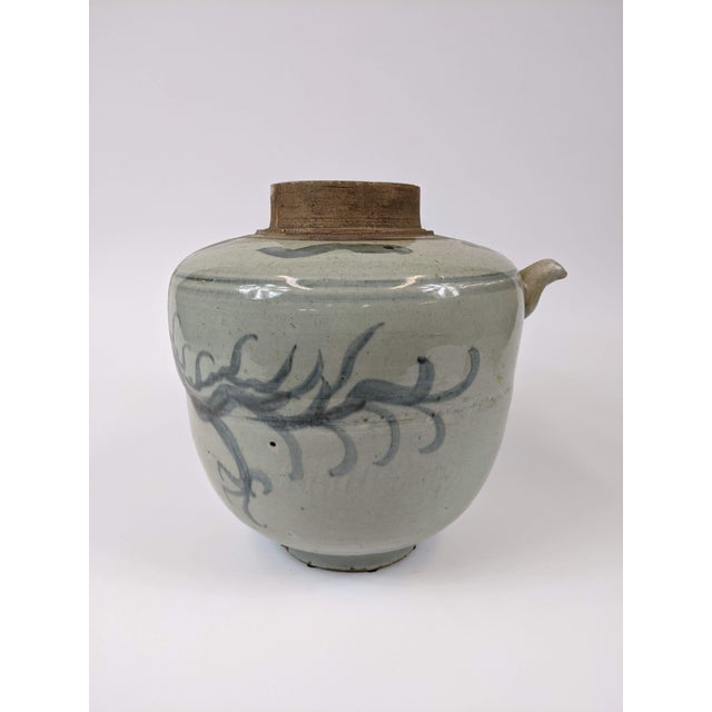 Unique blue and white jar with a wrap around dragon motif. Ming Dynasty