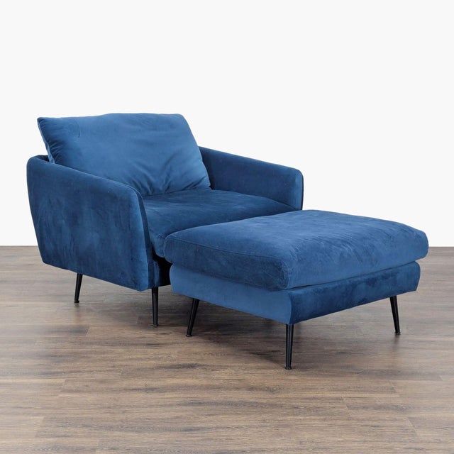 This Edloe Finch lounge chair comes with a matching ottoman and features soft blue velvet upholstery. Both pieces have...