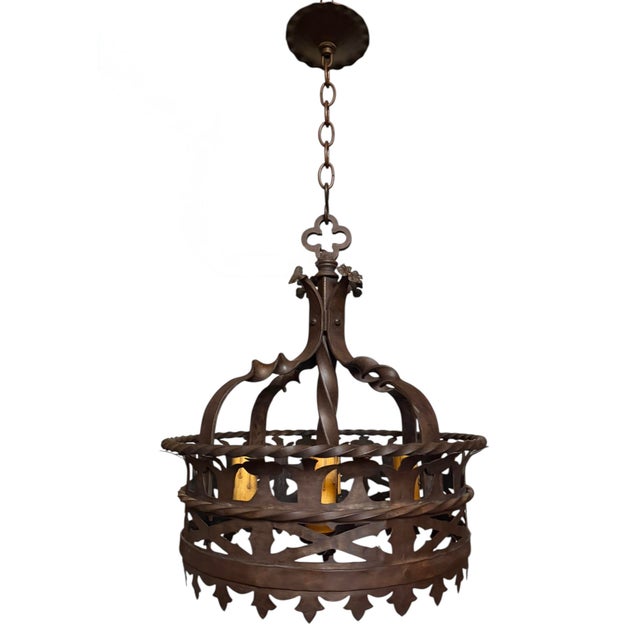 A rare early 1900’s cast and hand forged light fixture will add big charm to your space. Gorgeous scrollwork and patterns...