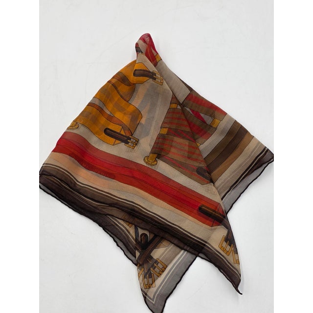 This Vintage Hermes Silk Scarf features a unique pattern of belts, designed in a square style. Made of 100% silk, this...