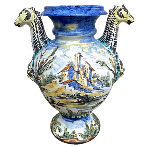 Vintage Italian hand-painted urn vase with giraffe handles and mask accents. Hand painted classic figures in repose scene...