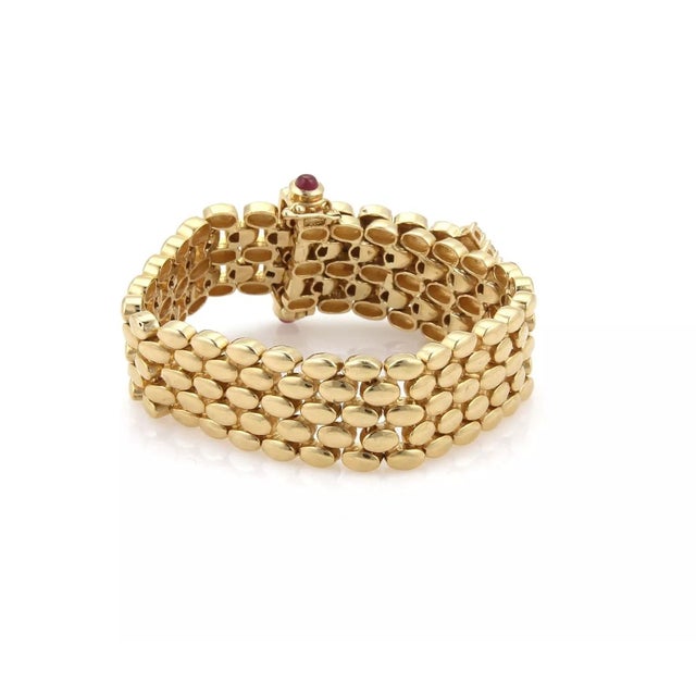 This is a magnificent yellow gold diamonds and ruby panther link ladies bracelet. The piece is beautifully crafted in 14k...