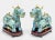 A whimsical pair of antique Chinese cloisonné incense burners in the form of kneeling horses on wooden stands, with...