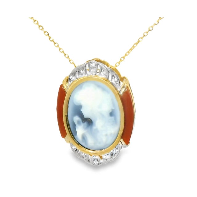 This exquisite vintage-inspired pendant features a finely carved blue agate cameo, elegantly accented with 12 brilliant...