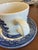 A charming set of four vintage Churchill England cups and matching saucers in a classic blue-and-white transferware...