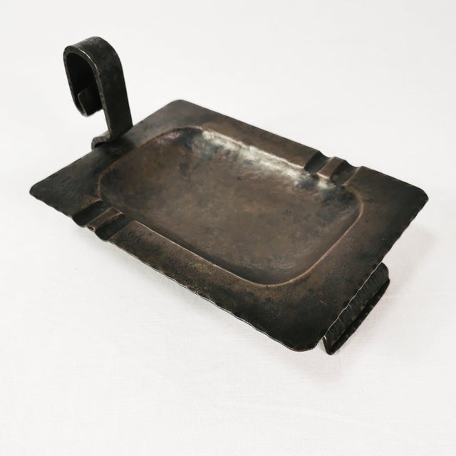 A heavy Brutalist-style study ashtray, made in Belgium in the 1960s. It is an example of post-war artistic metalwork and...