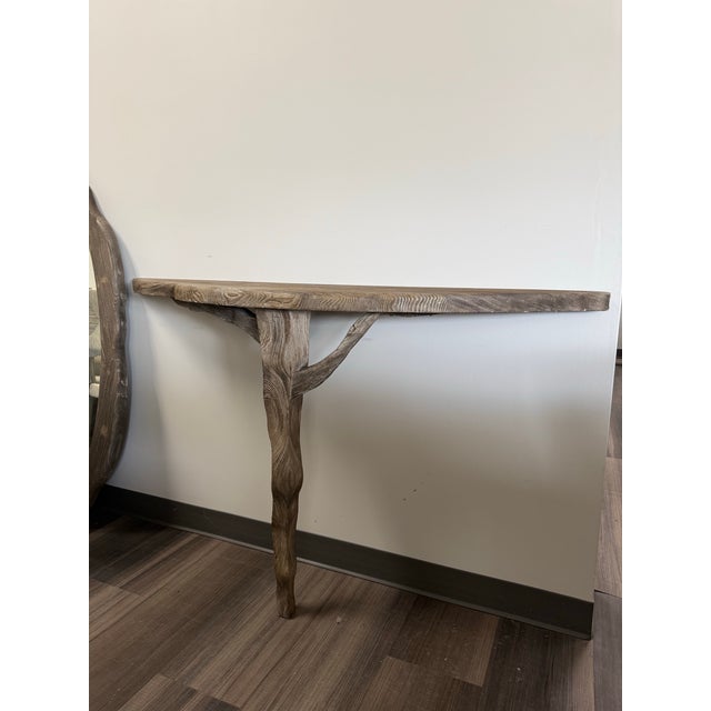 The Sherwood Console Table is a striking blend of organic form and artisanal craftsmanship. Featuring a slim, elongated...